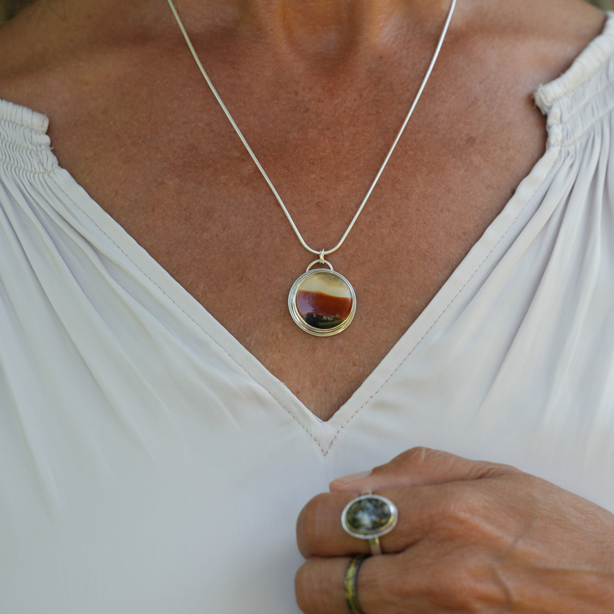Round Montana Agate black and brown Pendant