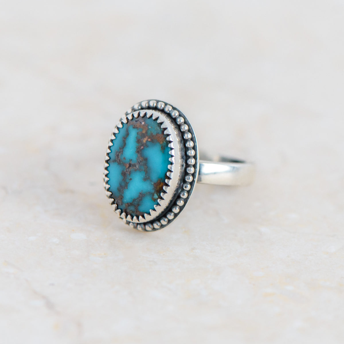 Dark Blue Turquoise Mountain Silver Ring with Beaded Surround