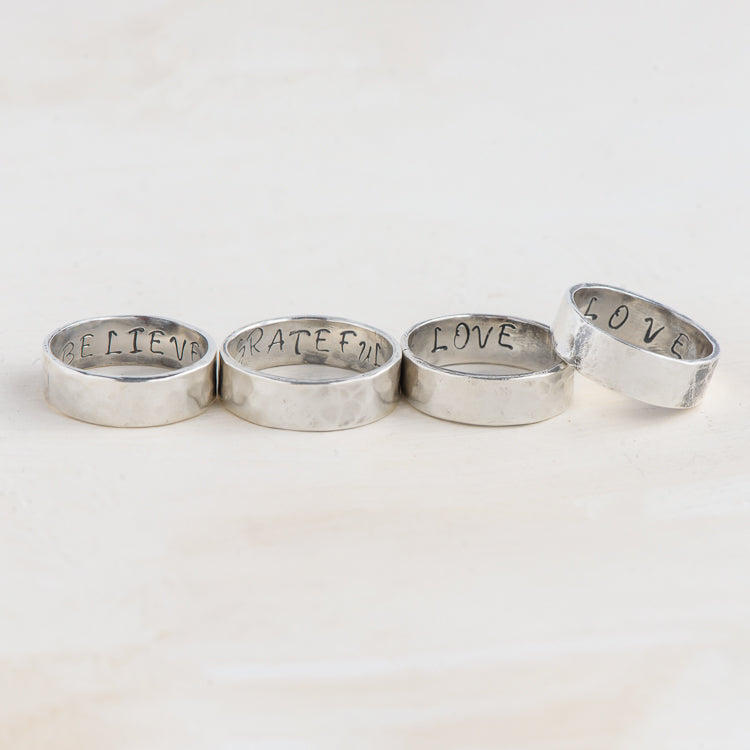 Handmade sterling silver hammered 'Message' Rings.