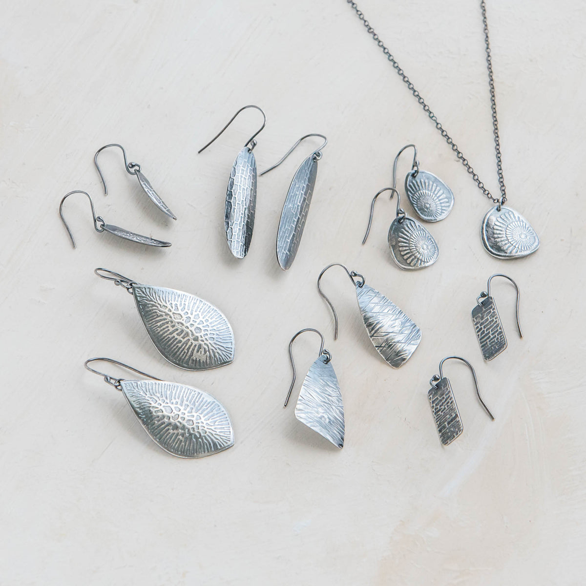 sterling silver jewellery york Statement Fashion Jewellery: Large Chunky  Curved Worn Silver Tone Earrings with Pitted Finish (7.5cm) (M494)A)  Sterling silver jewellery range of Fashion and costume and body jewellery.