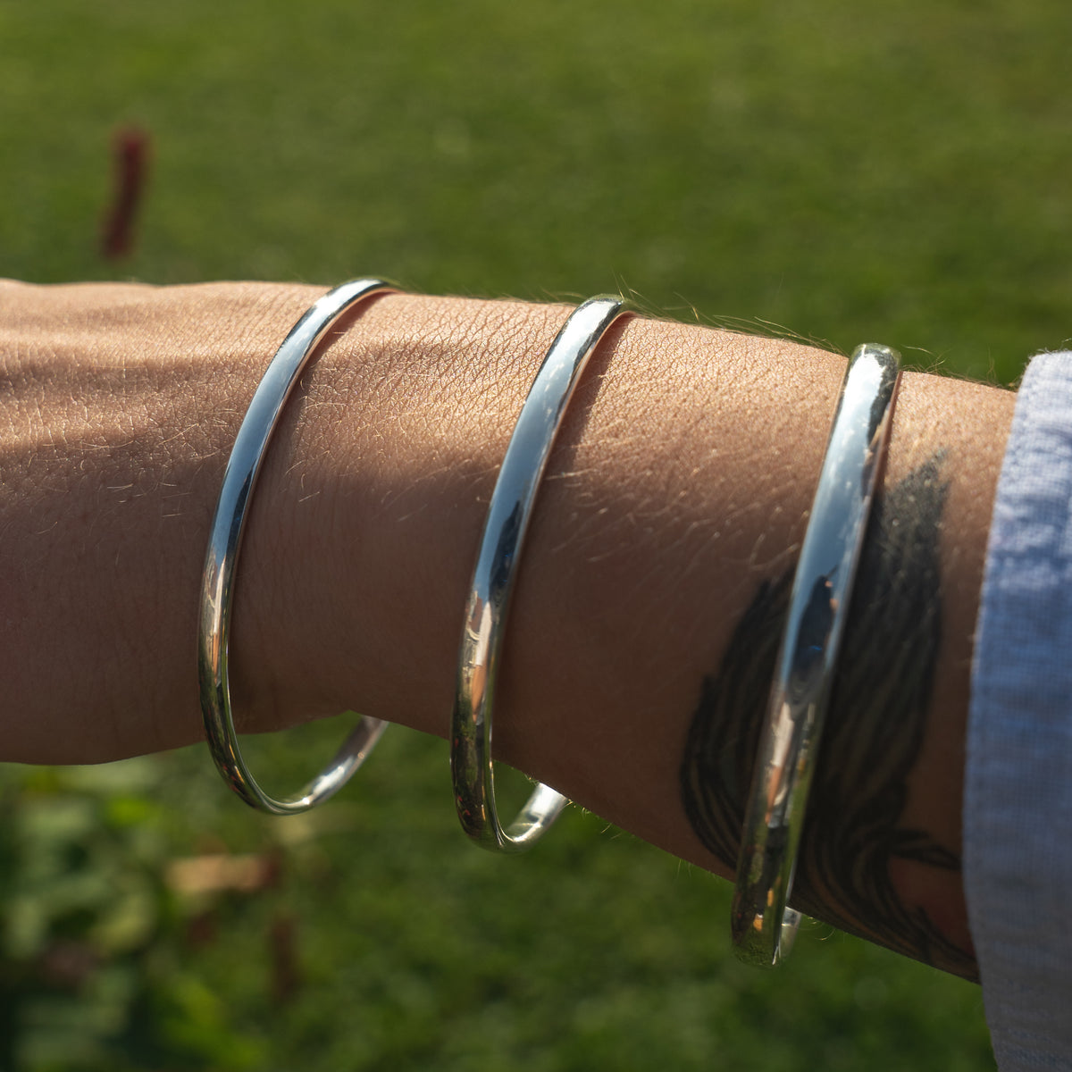 handmade sterling silver bangles in three thickness.  Made in the Uk by Laura De Zordo Jewellery