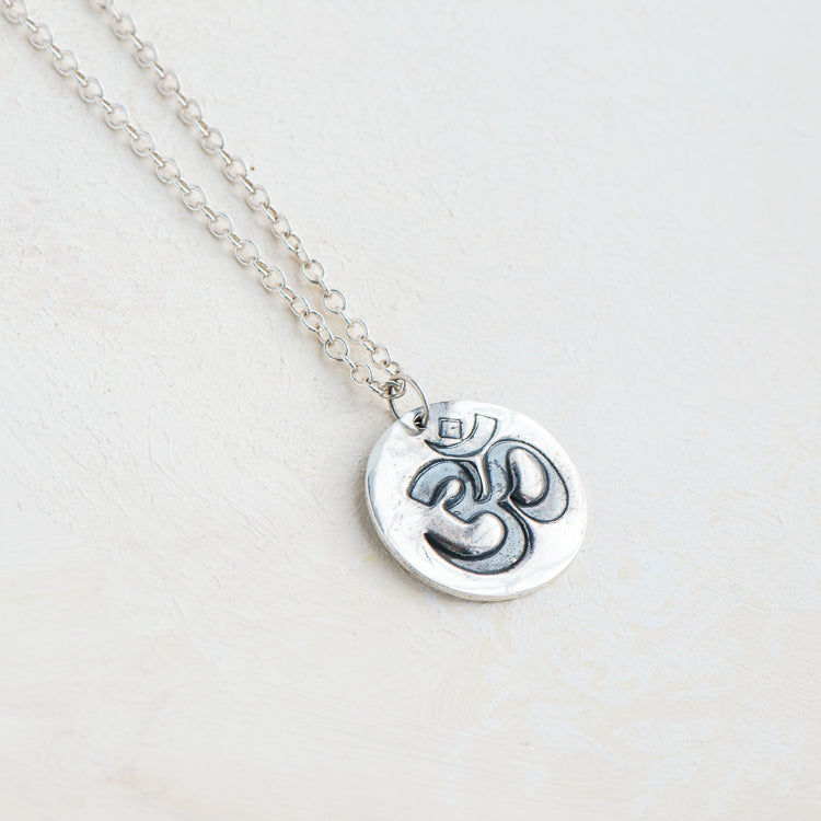 solid silver OM pendant handmade by Laura De zordo Jewellery