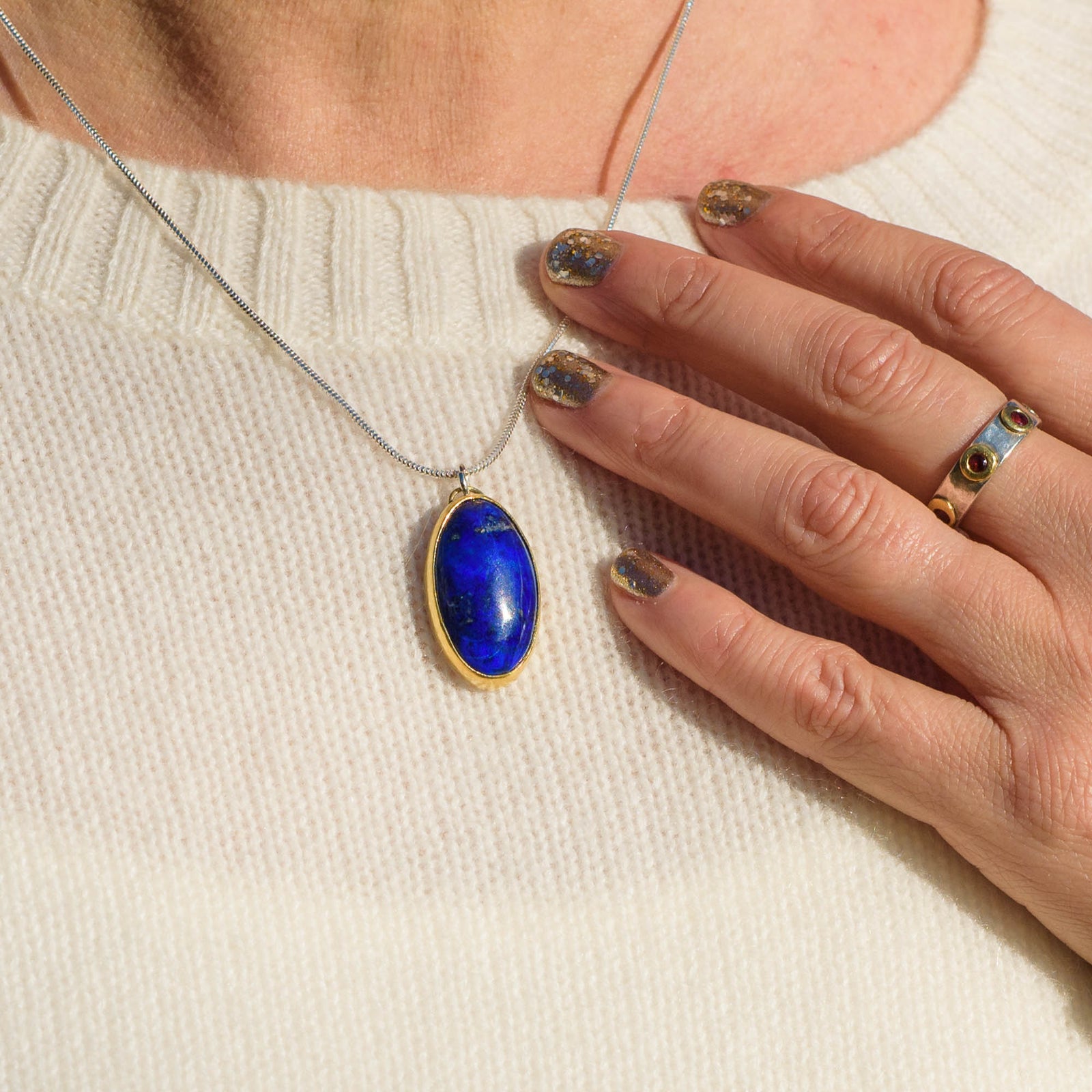 Lapis Lazuli Oval Pendant set in 22K gold with queen's jubilee hallmark.  Handmade by laura de zordo