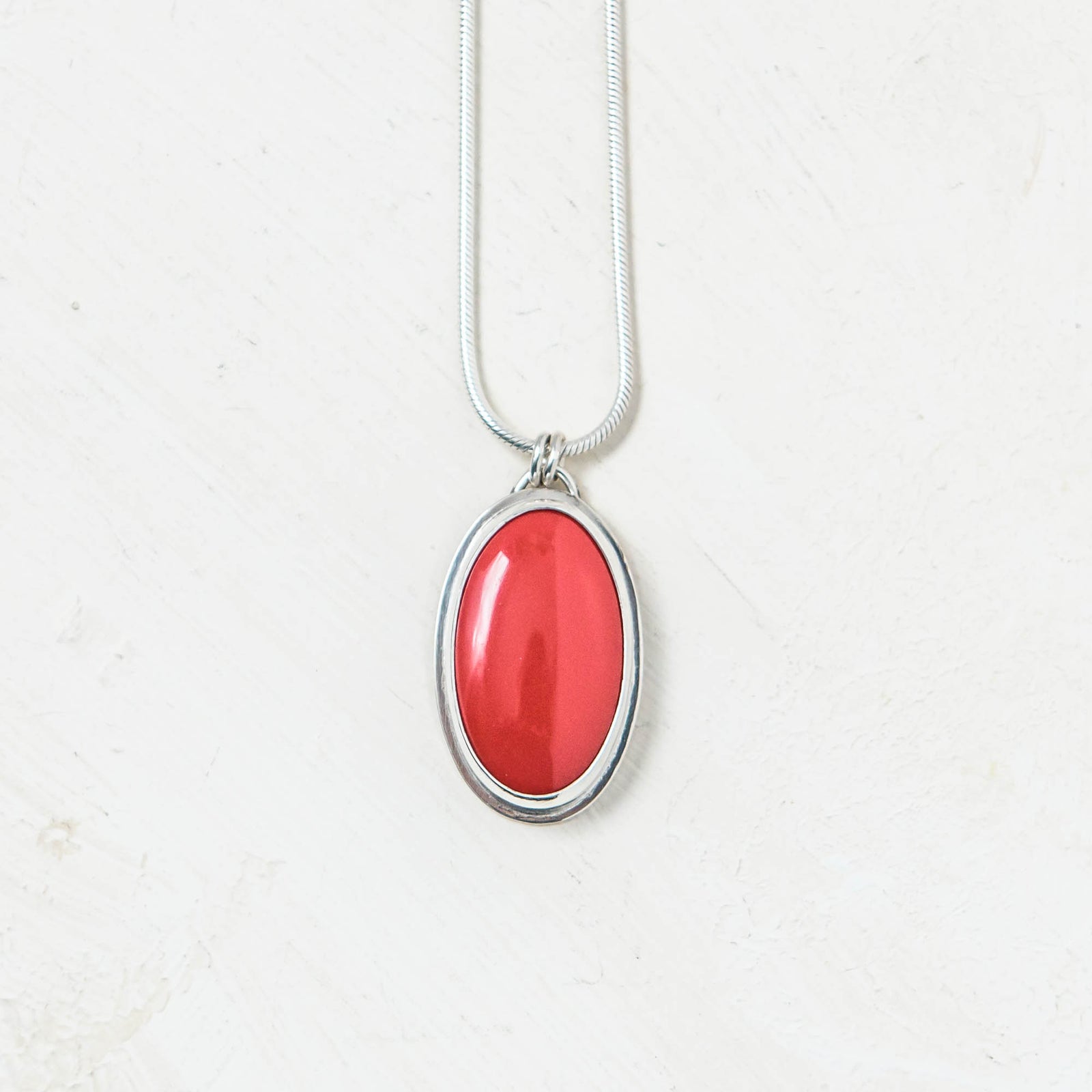 Red Rosarita Oval and Silver Pendant. Handmade by Laura De Zordo Jewellery