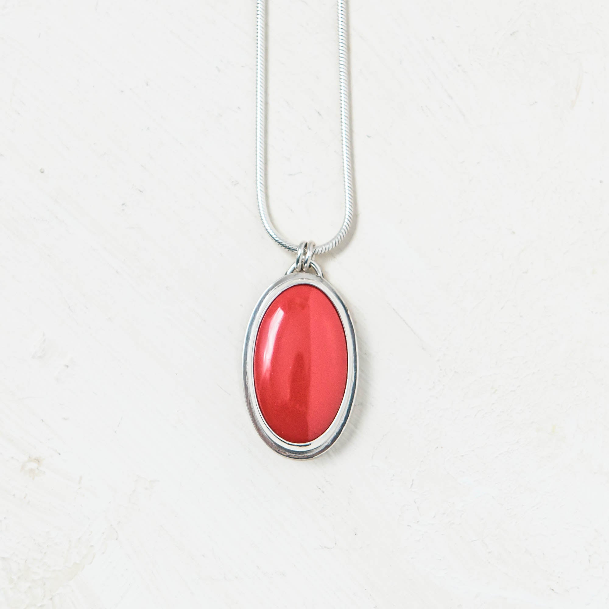 Red Rosarita Oval and Silver Pendant. Handmade by Laura De Zordo Jewellery